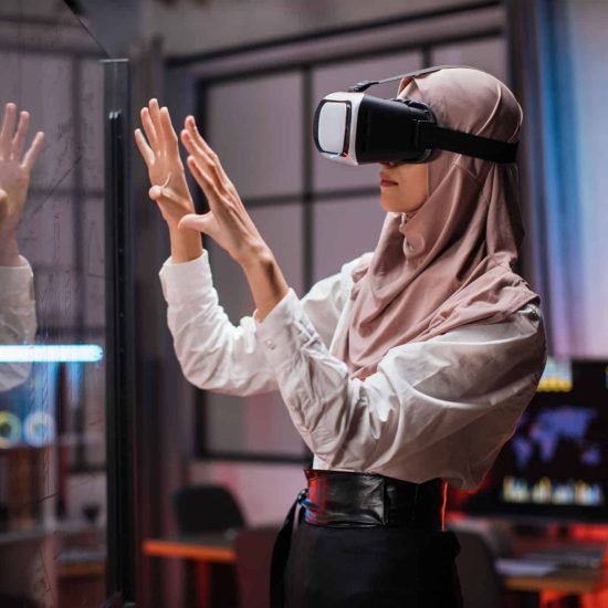 confident-muslim-woman-in-hijab-using-innovative-technology-during-business-strategy-1-1.jpg